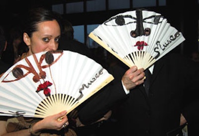 Honorary committee chair and artist Ruben Toledo hand-painted fans for guests.