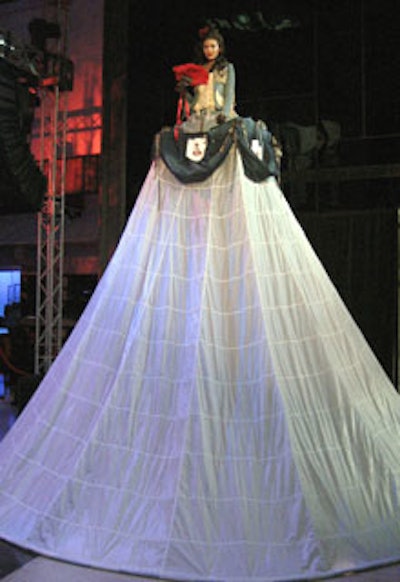 When guests first entered the event, they were greeted by the sight of a woman in a 14-foot-tall skirt.