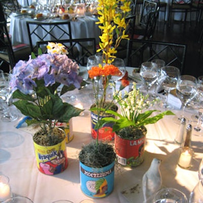 Diaz created 175 scale replications of the cans, which were wrapped with handmade Mexican canned food labels, filled with silk flowers, and placed on the 35 dinner tables.