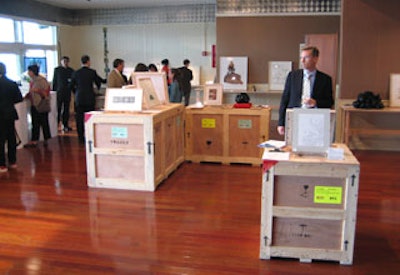 Silent auction items were displayed on real art packing crates.