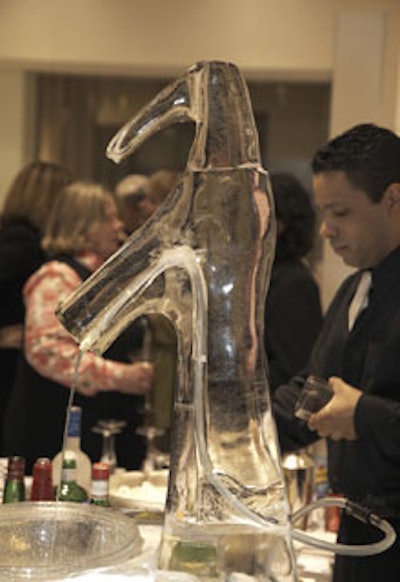 Real water flowed from Nadeau's Ice Sculptures' ice display in the shape of Kohler's Escale Lav and Symbol Faucet.