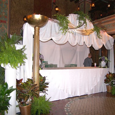 The Greek-themed opening of Lydian Bank & Trust's Tampa branch featured a bar with flowing white fabric, gold columns, and lots of plants.