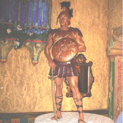 A gladiator posed on a pedestal in the reception area of the Tampa Theatre.
