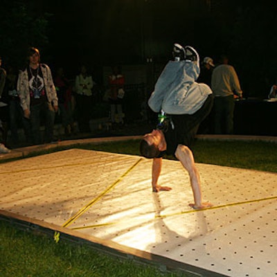 Break-dancers performed on the other side of the blue carpet.