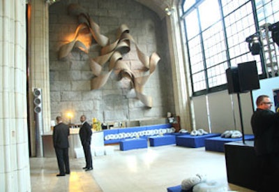 Blue couches and ottomans with throw pillows filled corners of Guastavino's for the after-party.
