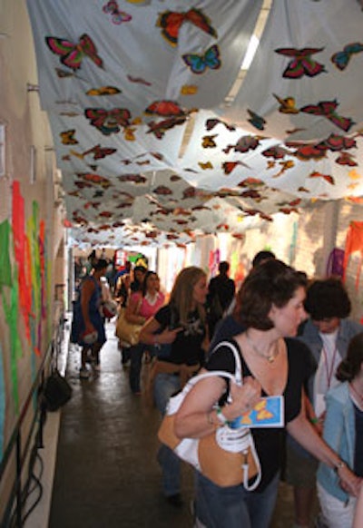 A ceiling of a ramp leading to the second floor of Industria Superstudio was decorated with butterfly-shaped decorations.