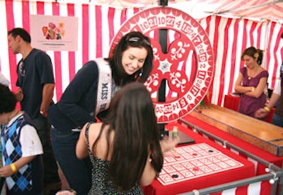 Children and adults played with old-fashioned games manned by celebrities.