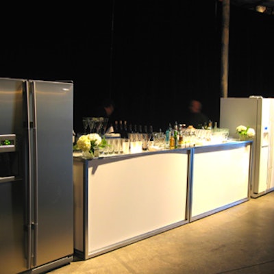 Digital refrigerators flanked the bar from Contemporary Furniture Rentals.