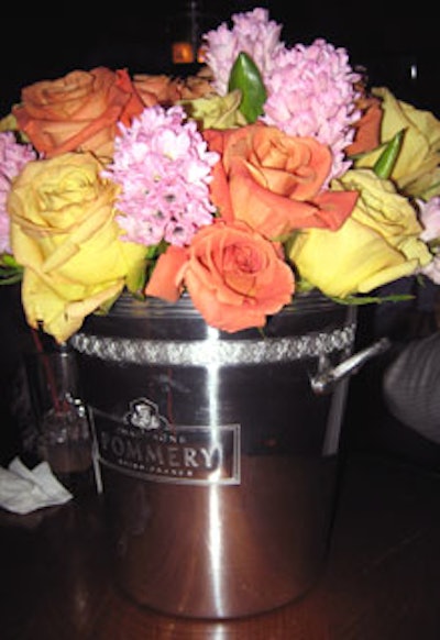 Fresh flowers in Pommery Champagne buckets served as centerpieces in the 'Pommery Place' lounge.