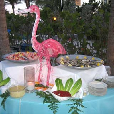 A lit pink flamingo decorated the seafood station, which offered shrimp cocktail, oysters, and conch fritters.
