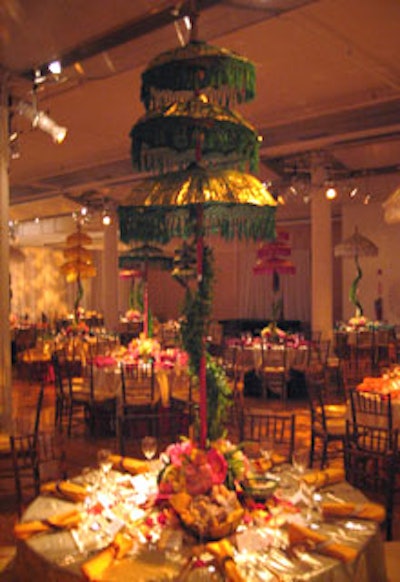 Tall, colorful parasols stood over dinner tables, which featured bright Indian-inspired shades of yellow, red, gold, and emerald green.