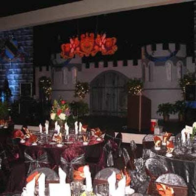 Tables were dressed with burgundy and metallic-colored linens.