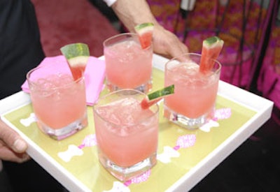 Servers passed appropriately pink drinks—watermelon martinis from Callahan Catering—on cute trays lined with images of the fragrance bottle. (Pink cotton candy was another fun catering touch.)