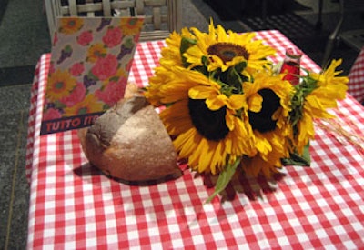 A cute tabletop touch: loaves of bread served as signage stands in the seating area.