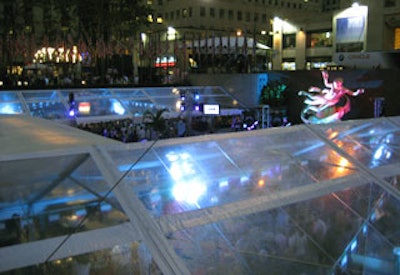 Bentley Meeker filled the tented area with blue light as night fell. The lighting equipment and design was the same used for the Tony awards gala in the same space the previous night.