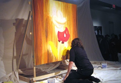 Artist Trevor Carlton whipped up a painting of Mickey Mouse during the event.