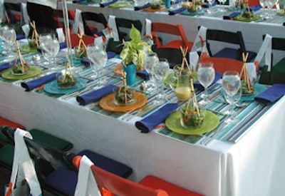 Linens and tableware from TriServe covered the long banquet tables. The potted plant centerpieces will be planted in Battery Park's playground.