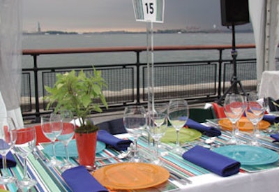 Half of the dinner guests faced New York Harbor with a view of the Statue of Liberty.
