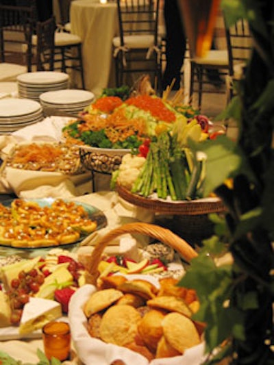 Whole roasted salmon stuffed with spinach and basmati rice and covered with cucumbers and salmon roe; baskets of crudités and rolls, and trays of hors d'oeuvres covered the preawards dinner buffet table.