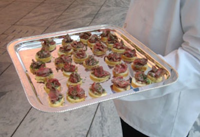 Glorious Food catered the dinner a menu that included filet of beef on baguette slices with a horseradish sauce.