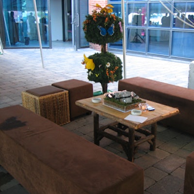 Signature Rentals outfitted the patio with rattan and suede seating and wood coffee tables.