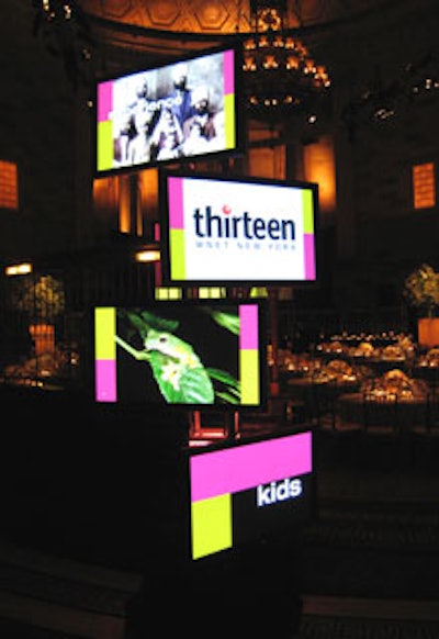 Entries to the oval-shaped center of Gotham Hall’s main space were marked by towers of plasma screens that displayed footage of the networks’ programming.