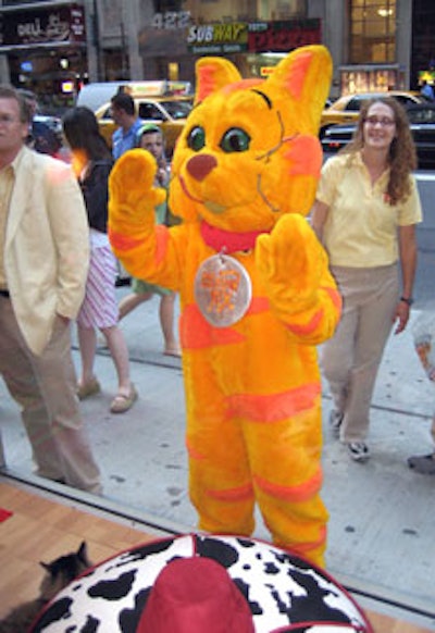 A cat-costumed actor waved to the cat contestants from outside the storefront.