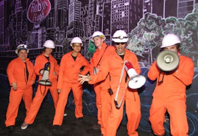 A team of chalk-drawing artists dressed as construction workers roamed the floor of the cocktail room, adding images to the cityscapes.