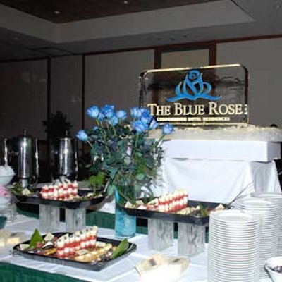 An ice sculpture with an illuminated blue rose decorated the international food station.