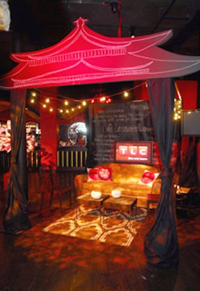 A chalkboard-drawn pagoda housed the TLC lounge. Guests were able to add their own lessons to the chalkboard coffee tables and backdrop.