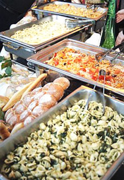 Buffet tables filled with pasta, grilled meats, and desserts were strategically placed on the patios and around the fountain.