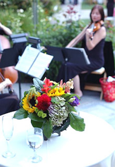A string trio played Italian Renaissance and Baroque music in the background.