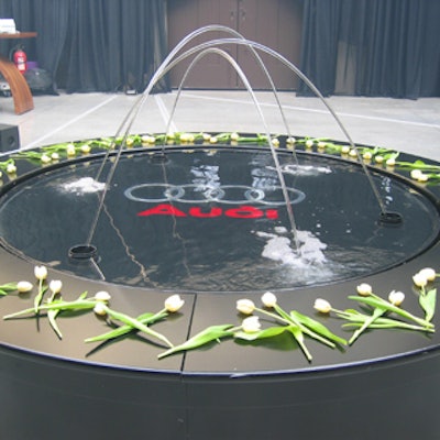 Solar Aquatics projected the Audi name and logo onto a water fountain in the middle of the main event space at Muzik for Audi Canada's media launch of the new Audi Q7.