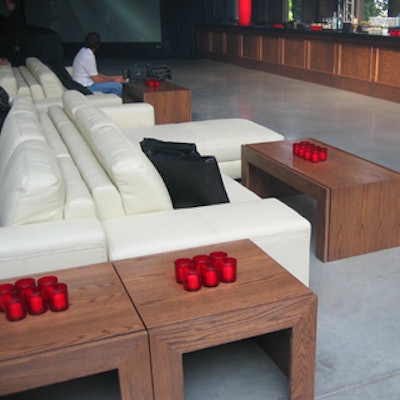 Muzik created a lounge area with white couches and wooden coffee tables.