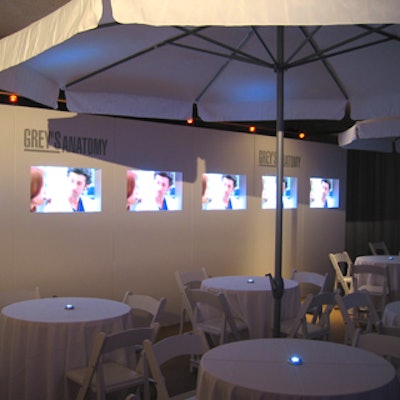 Scenes from Grey's Anatomy played on a row of TV screens in the lounge devoted to the program.