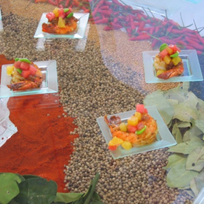 George Brown Chef School emphasized presentation with its Malay-style shrimp with watermelon, fava, and pineapple served on clear glass over a bed of colourful spices and beans.