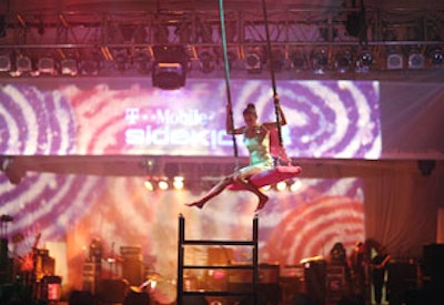 A girl on a swing dangled over the event the entire evening.
