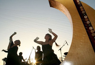 String Theory Productions captivated guests with their unique sound created by an elaborate string installation that was constructed site-specific to the event. Strings extended all the way from the roof of the Pacific Design Center to the patio below, enveloping guests in a majestic musical landscape.