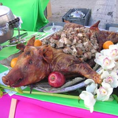 Mena Catering provided Latin cuisine such as chunks of pork served in the actual roasted pig.