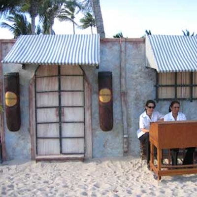 A cigar factory fa?ade housed two cigar rollers who handed out stogies all night.