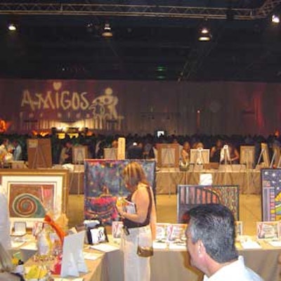 Guests perused the long aisles filled with a variety of items during the silent auction.