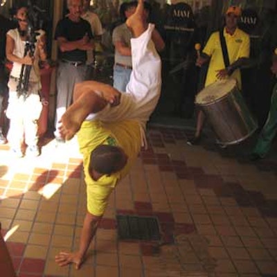 A capoeira dancer entertained the crowd on the Miami Art Museum plaza.