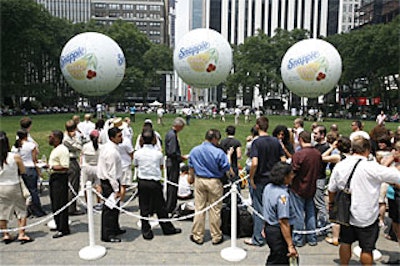 Parkgoers lined up to take a lift in the helium-filled balloons.