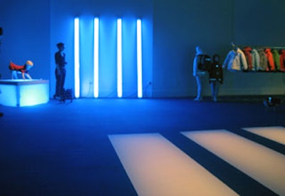 The Cool Blue four-bar logo appeared on the floor and echoed with an installation of four fluorescent tubes propped against a wall.