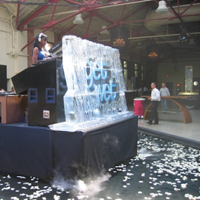 The words Get Wet decorated a wall of ice from Iceculture at the front of the DJ booth.