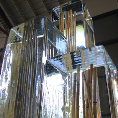 Rectangular columns of ice encased bundles of bamboo.