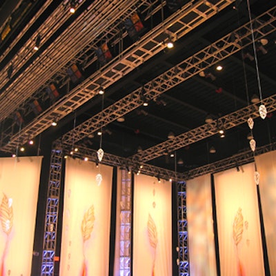 Ceiling-hung silk panels decorated with hand-painted falling leaves formed the stage backdrop.
