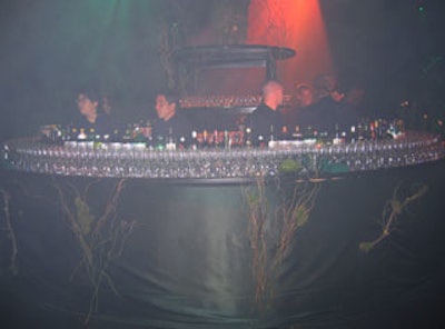 The vine-encrusted 16-foot circular bar was surrounded by highboy cocktail tables, also covered in vines and moss.