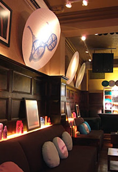 Lines from the products' advertising-like 'My hair's so poofy I should stuff my bra with it'-were printed on large circular posters resembling soap bubbles, which hung along the walls.