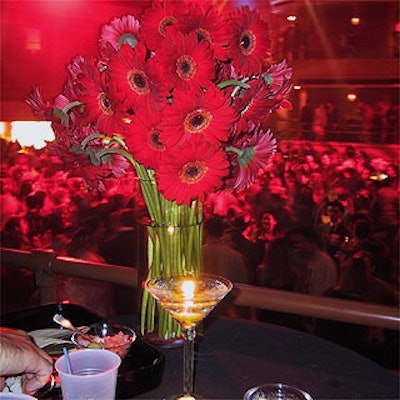 Musters & Company put bright red flowers throughout Hammerstein Ballroom.